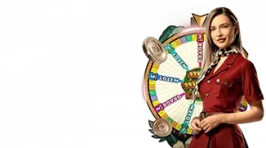 Image featuring a female host standing next to a spinning game wheel, promoting the Snakes and Ladders live game at Gizbo Online Casino.